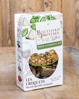 Produktbild der Biscuiterie de Provence „Les Croquets – Pistou & Parmesan AOP“: Verpackung mit Basilikum- und Käse-Illustrationen sowie Sichtfenster mit knusprigen Aperitif-Brotscheiben mit Mandeln