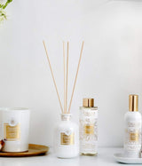 Collines de Provence Raumduftkollektion mit Coton Duftkerze, Néroli Duftdiffuser, Nachfüllflakon und Coton Raumspray in elegantem Weiß-Gold-Design