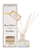 Durance Duftdiffuser Goldenes Teak Glasflakon mit Holzstäbchen vor Verpackung Raumduft aus Frankreich