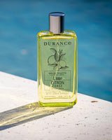 Durance Eau de Toilette Homme Citron Corse 100 ml Flakon mit Zitronenduft am Poolrand inszeniert
