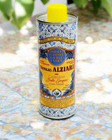Nicolas Alziari extra natives Olivenöl Dose auf Fliesen mit gelbem Deckel