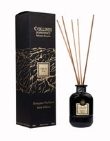 Collines de Provence Duftdiffuser Ebenholz mit schwarzen Duftstäbchen und schwarzer Glasflasche neben passender Produktverpackung auf hellem Hintergrund.