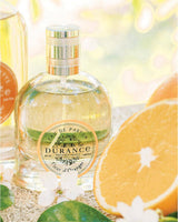 Durance Eau de Parfum Orangenblüte mit Orange und Blüten dekorativ dargestellt.