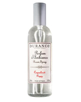Durance Raumspray Mohnblume in transparenter Glasflasche mit silbernem Sprühkopf auf hellem Hintergrund